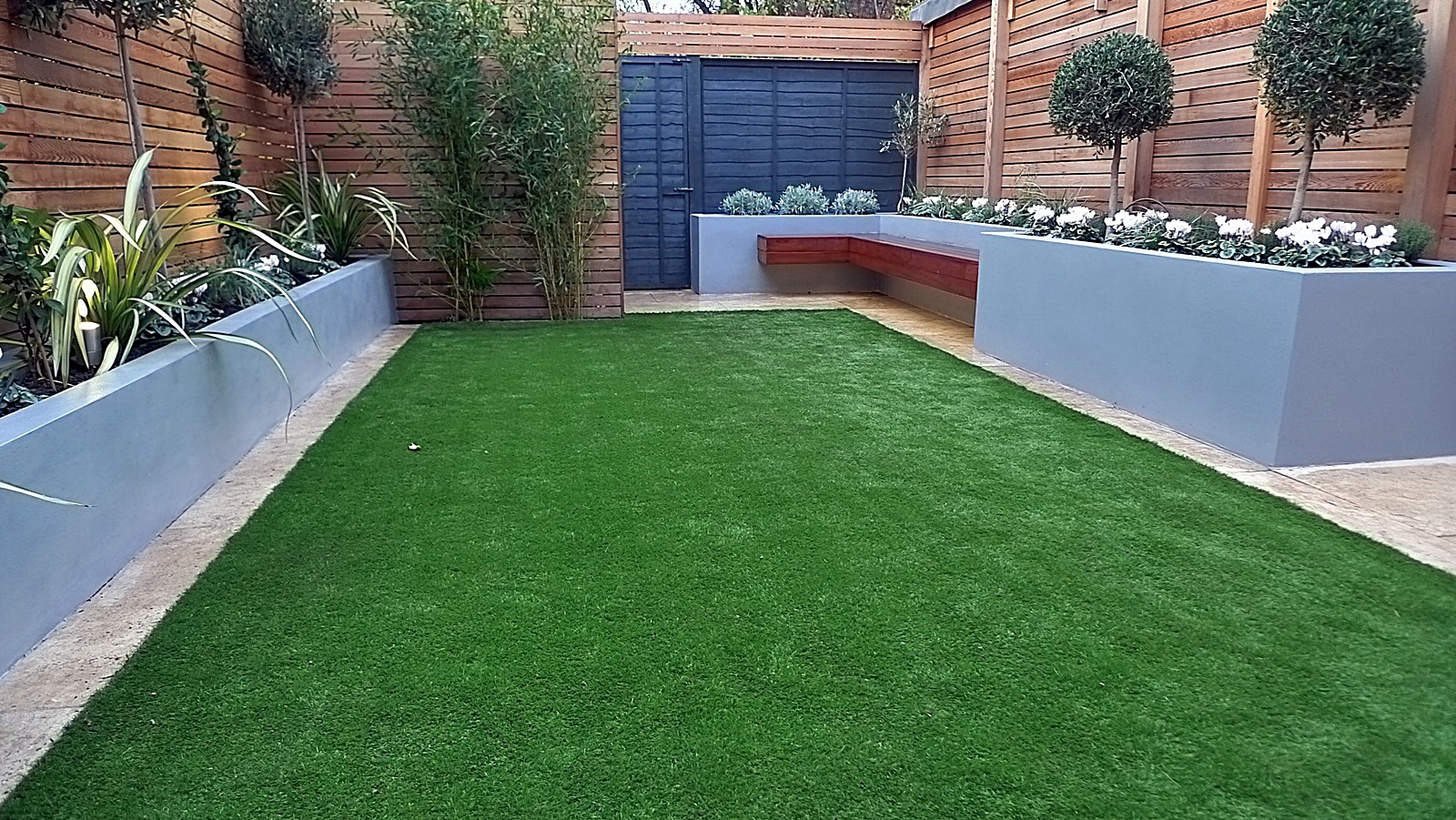 Chelsea Dulwich London artificial grass topiary planting fence grey walls raised beds Streatham Clapham