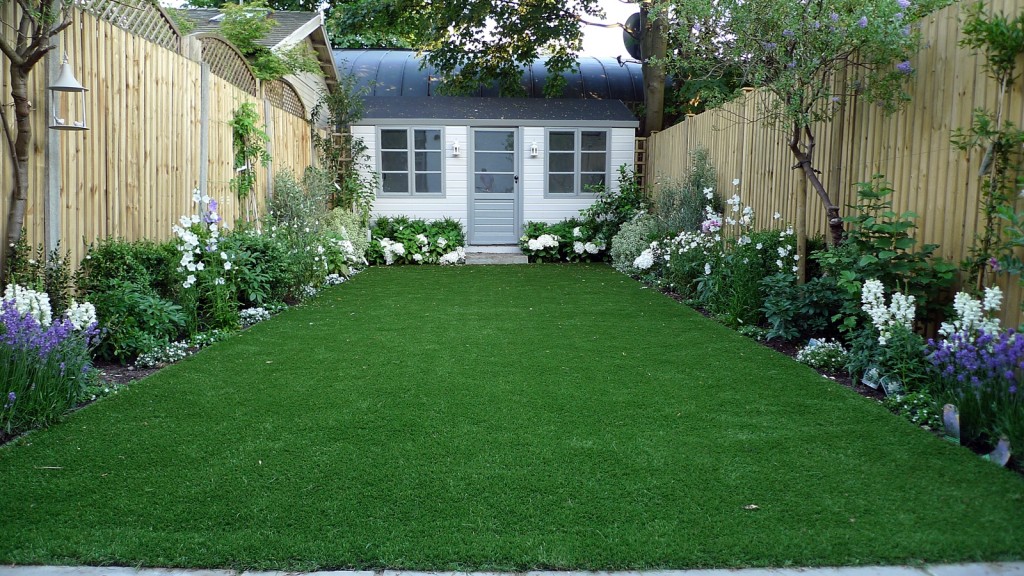 artificial easy grass lawn summer house sandstone paving and white flower planting scheme (1)