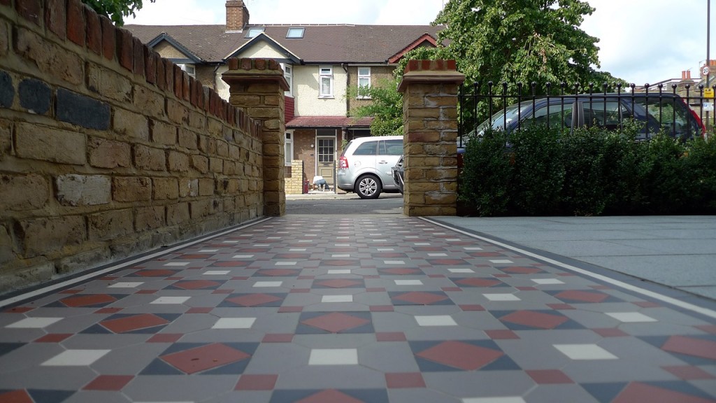 victorian mosaic garden path balham london with yellow brick wall