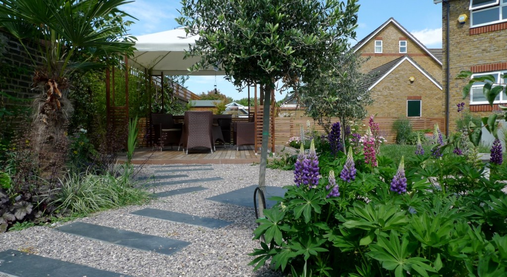 large modern garden design earlsfield south west london artificial grass hardwood screens balau decking slate paving patio mature planting (18)