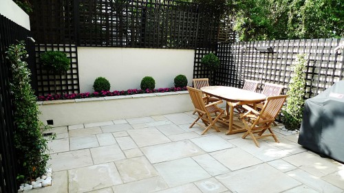 Sandstone paving patio raised beds classic modern planting black ...