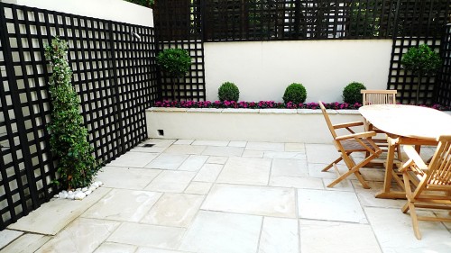 Sandstone paving patio raised beds classic modern planting black ...