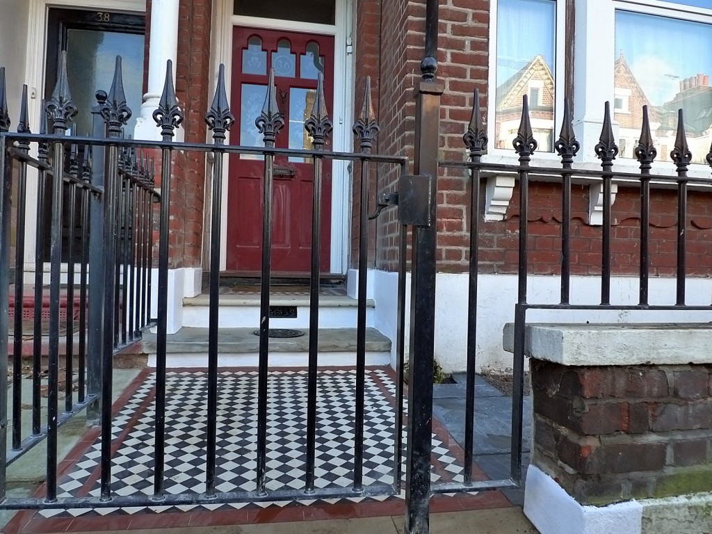 Brick red garden wall metal rail iron gate London Brixton Balham wrought
