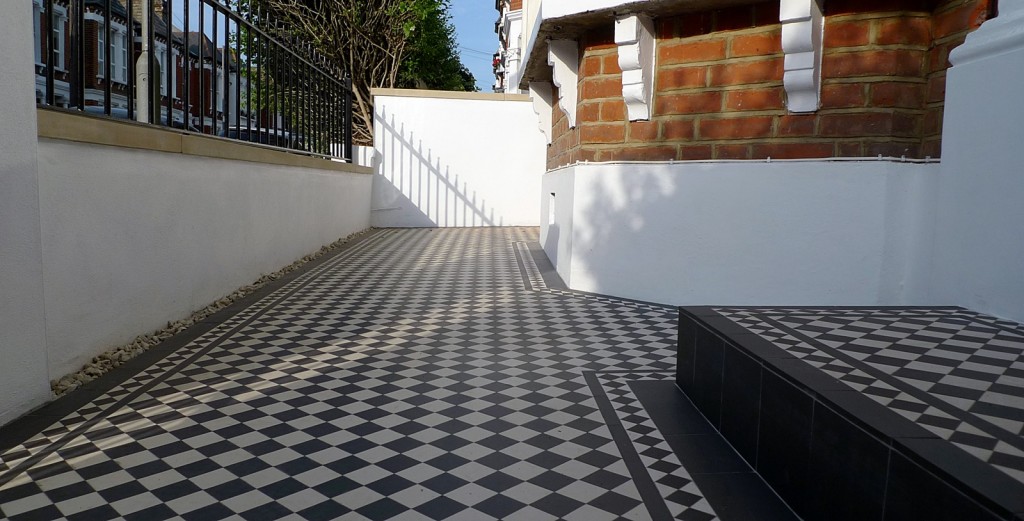 black and white victorian mosaic yorkstone render block wall wrought metal rail and gate chelsea fulham london