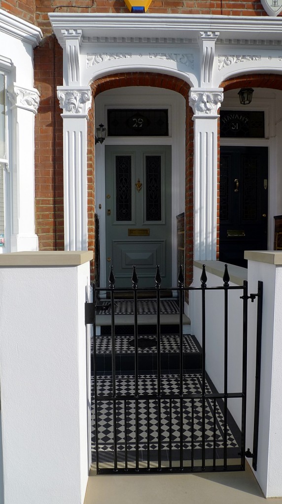 black and white victorian mosaic yorkstone render block wall wrought metal rail and gate fulham chelsea london