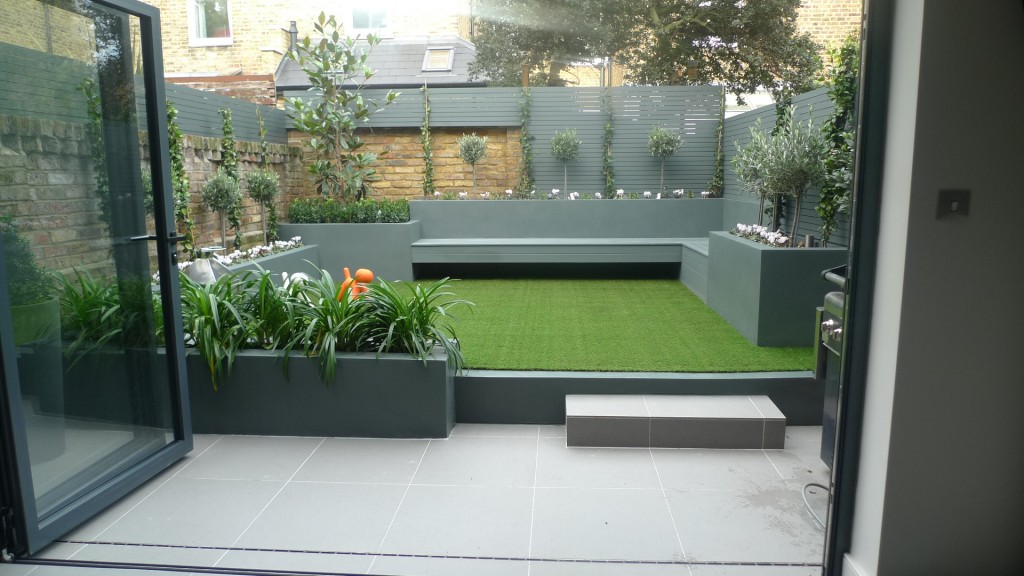 modern small low maintenance garden fake grass grey raised beds contemporary planting docklands london