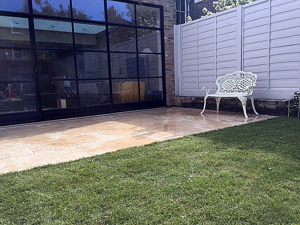 Privacy screen hardwood painted  fence real grass travertine paving fence planting Balham Wandsworth Clapham London